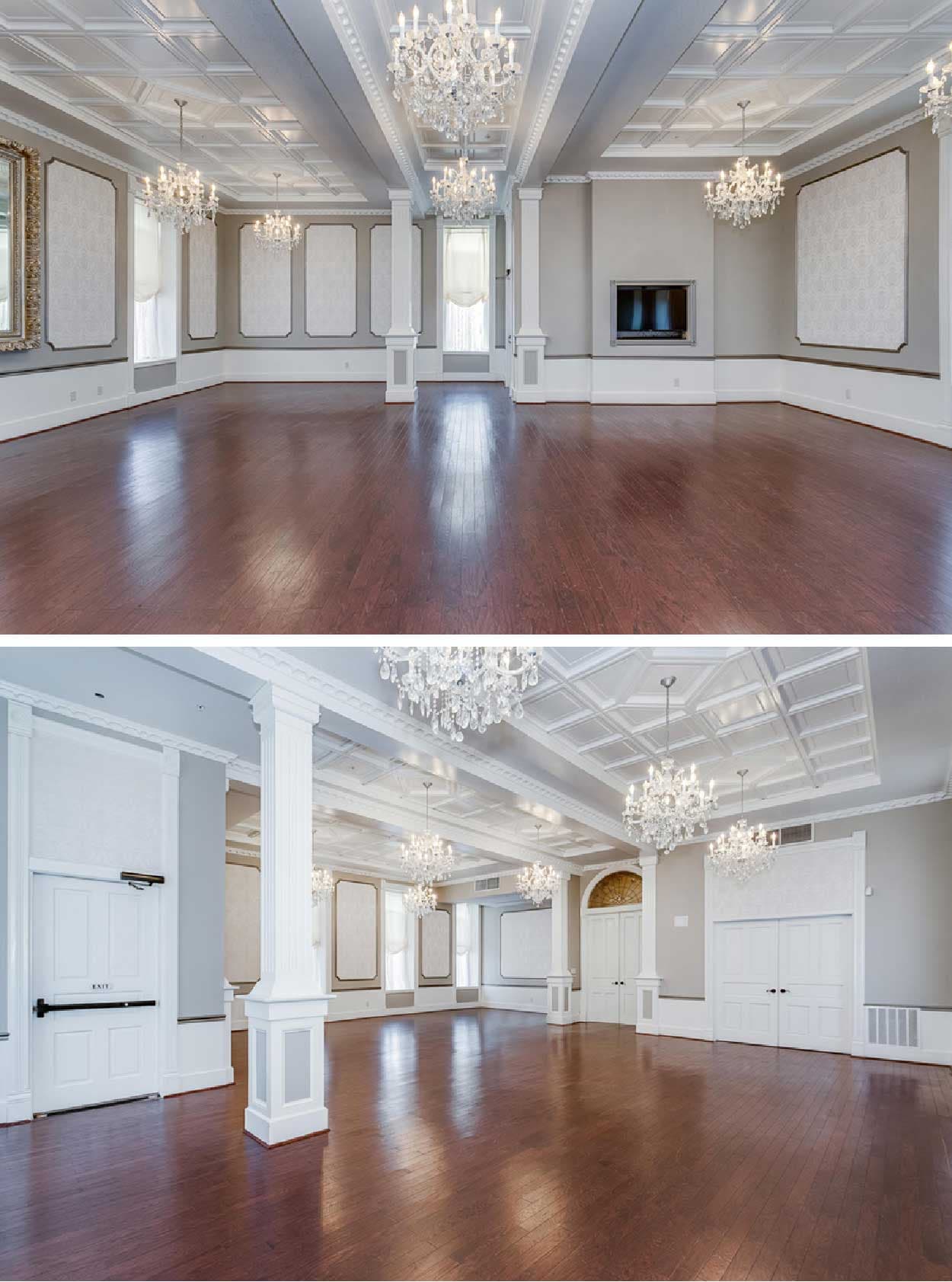 A spacious, elegantly designed room with a polished wooden floor and decorative chandeliers.