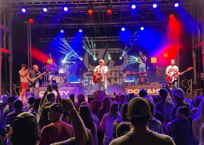 a live band playing on stage at chingawassa days festival in 2024 a live band playing on stage at chingawassa days festival in 2024